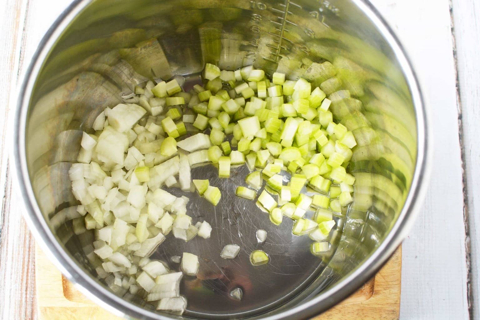 chopped celery and onion in pot