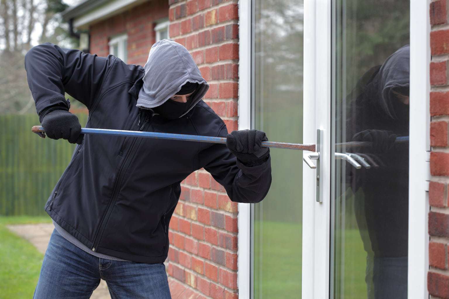 a burglar breaking into a door