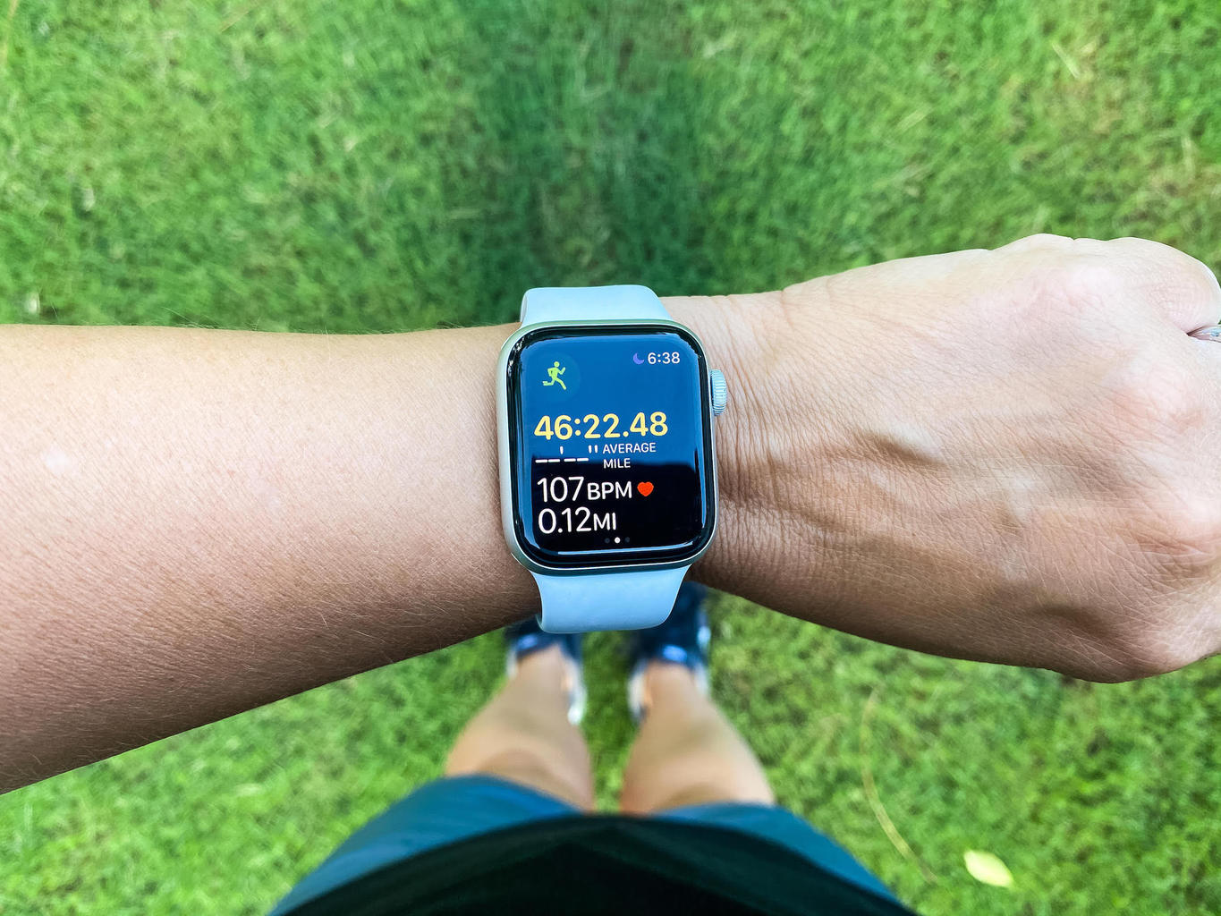 a woman tracking her steps with her watch creating healthy habits