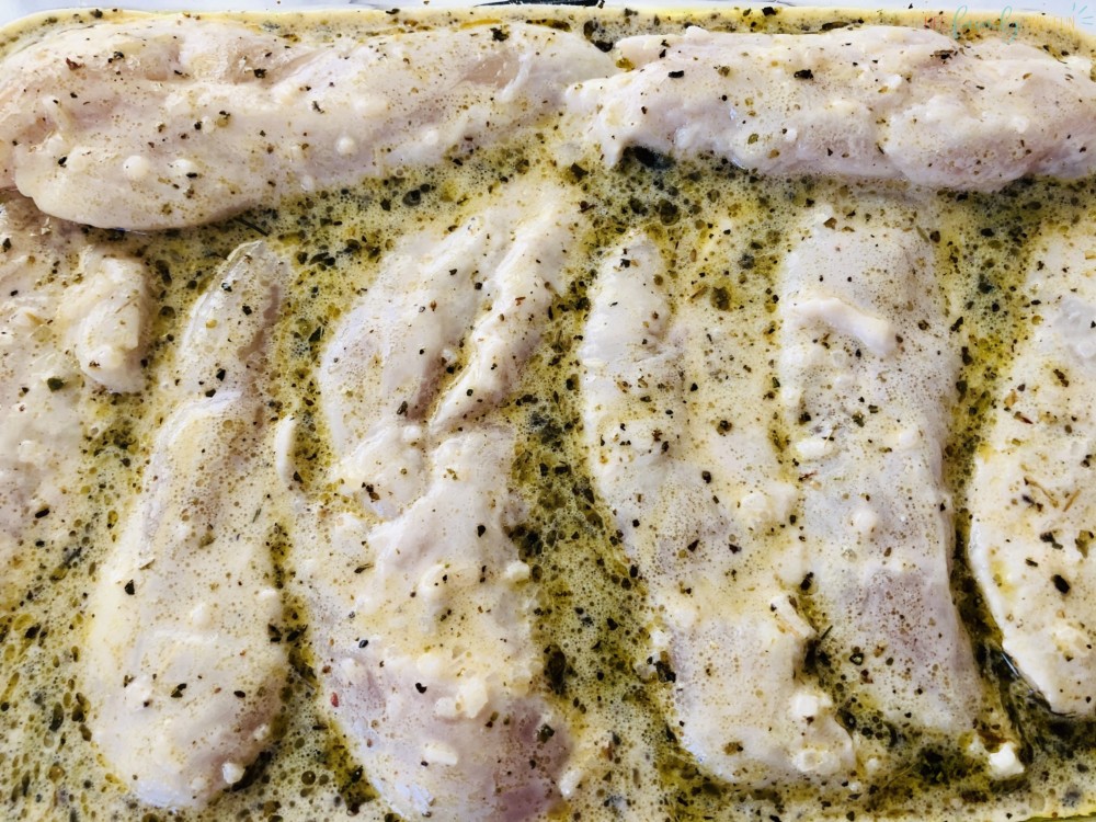 Greek chicken marinade cooking in dish