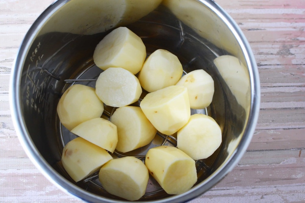 raw potatoes on trivet in instant pot