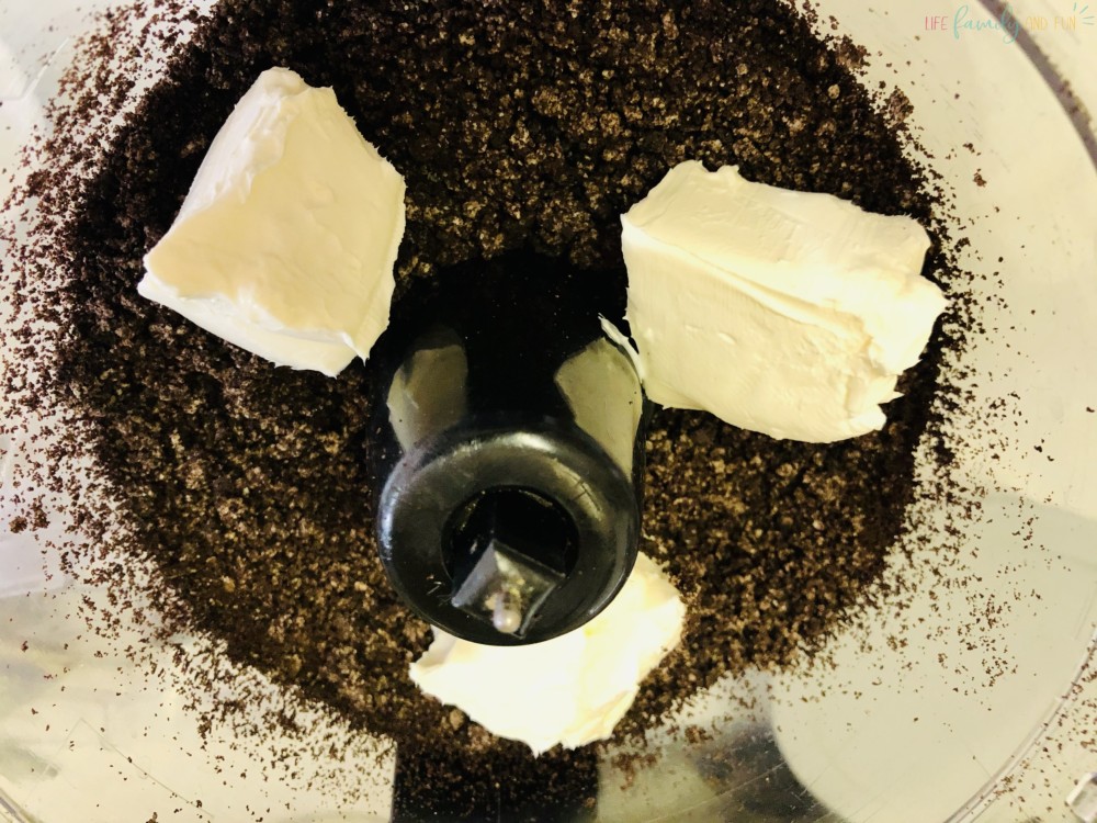 Oreo crumbles and cream cheese in food processor