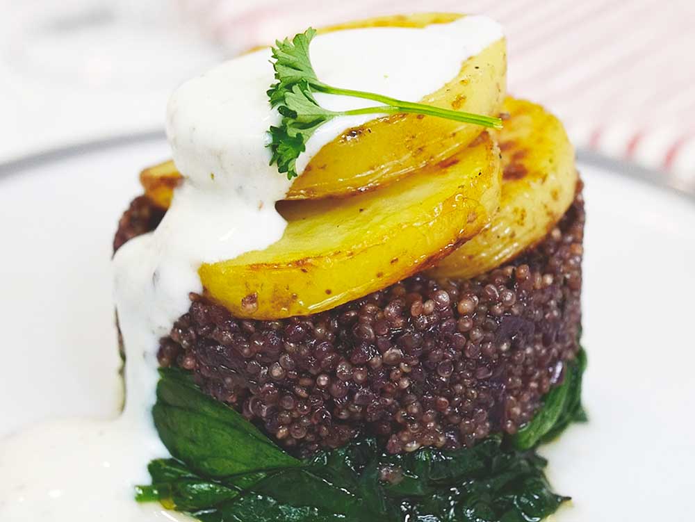 Red Wine Quinoa on Wilted Spinach, with Potatoes and Tahini Dressing