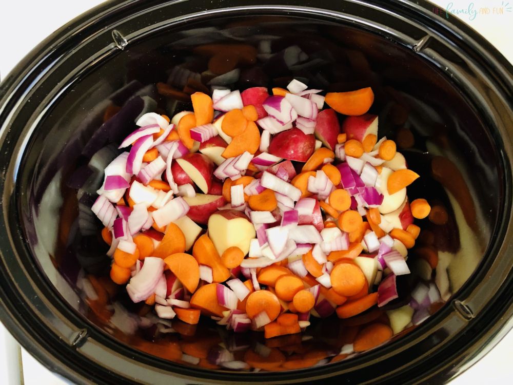 raw chopped vegetables in slow cooker