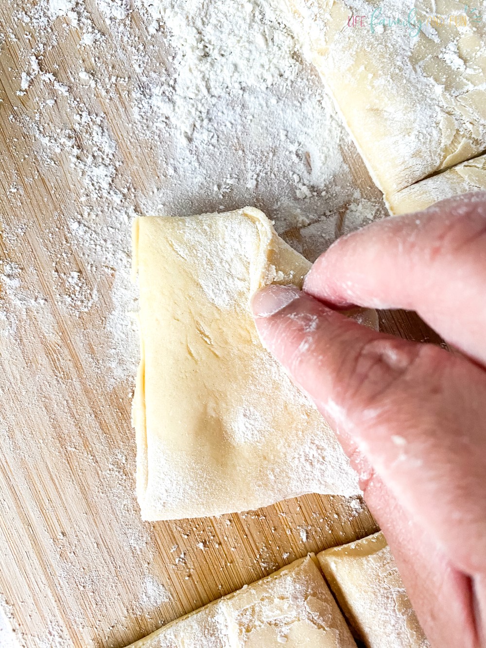 folding dough in flour
